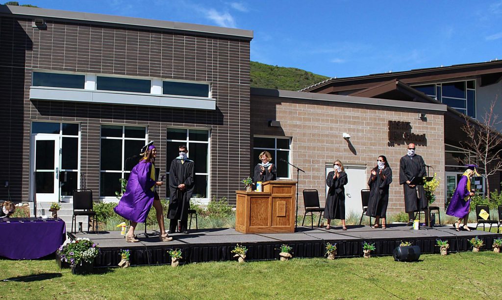 Basalt High School Class of 2020 seniors bump elbows with their administrators and teachers after receiving their diplomas on May 30, 2020. (Maddie Vincent/The Aspen Times).
