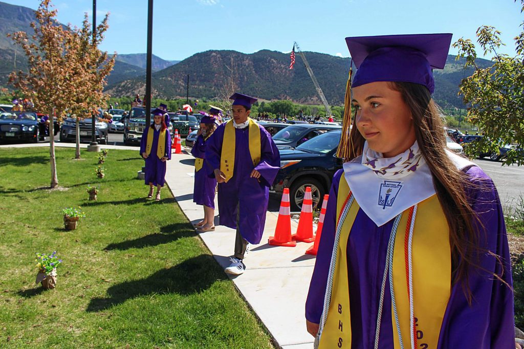 Basalt seniors line up 6 feet apart to get their diplomas on May 30, 2020. (Maddie Vincent/The Aspen Times).