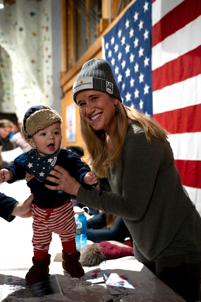 U.S. ski team member Alice McKennis greets a child during a fan event.
