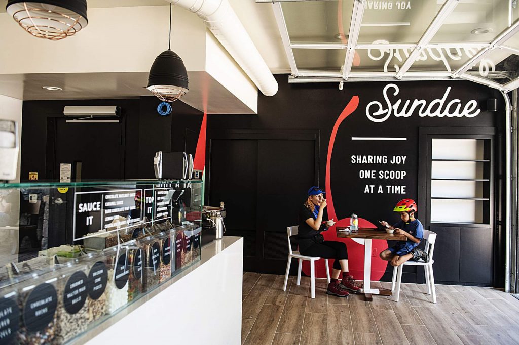 Aurora Chavez, left, and Tiago Canales, 9, enjoy a scoop from Sundae in Snowmass Base Village on Thursday, July 30, 2020.