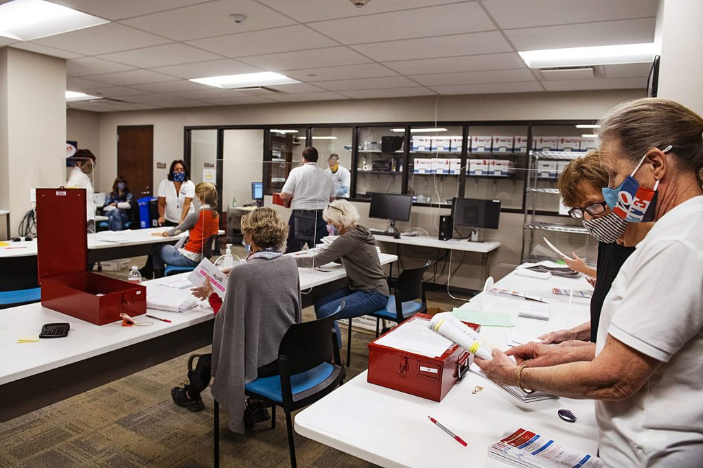 Election officials open and check ballots in the Pitkin County Administration building on Election Day in Aspen on Tuesday, Nov. 3, 2020. (Kelsey Brunner/The Aspen Times)