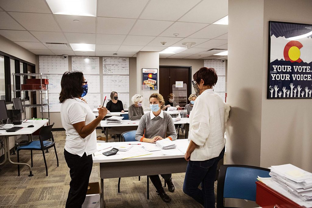 Election officials open and check ballots in the Pitkin County Administration building on Election Day in Aspen on Tuesday, Nov. 3, 2020. (Kelsey Brunner/The Aspen Times)
