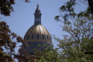 Colorado Gov. Jared Polis signs state budget, with Medicaid taking brunt of cuts to close $1 billion gap