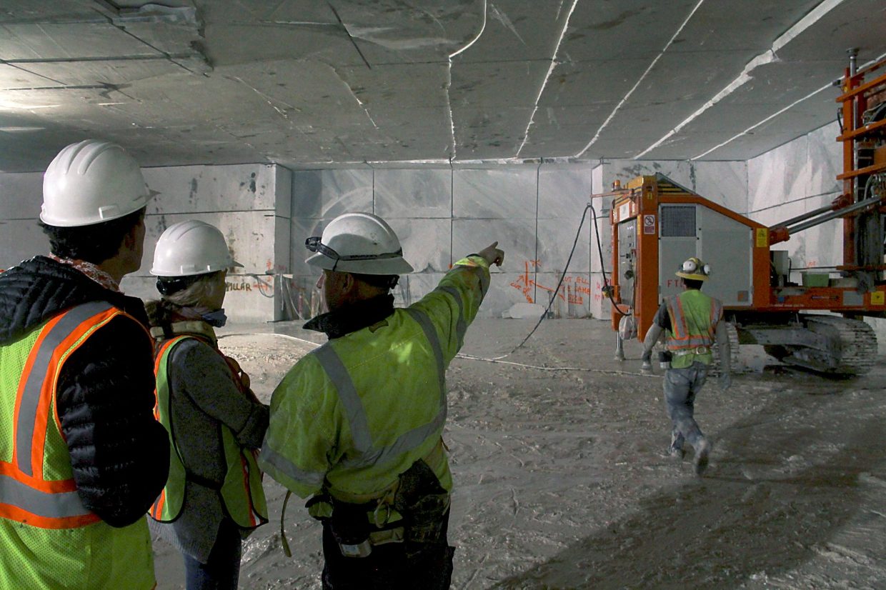 Stefano Mazzucchelli (right) explains one of the saws in the Lincoln Gallery of Colorado Stone Quarries above Marble.