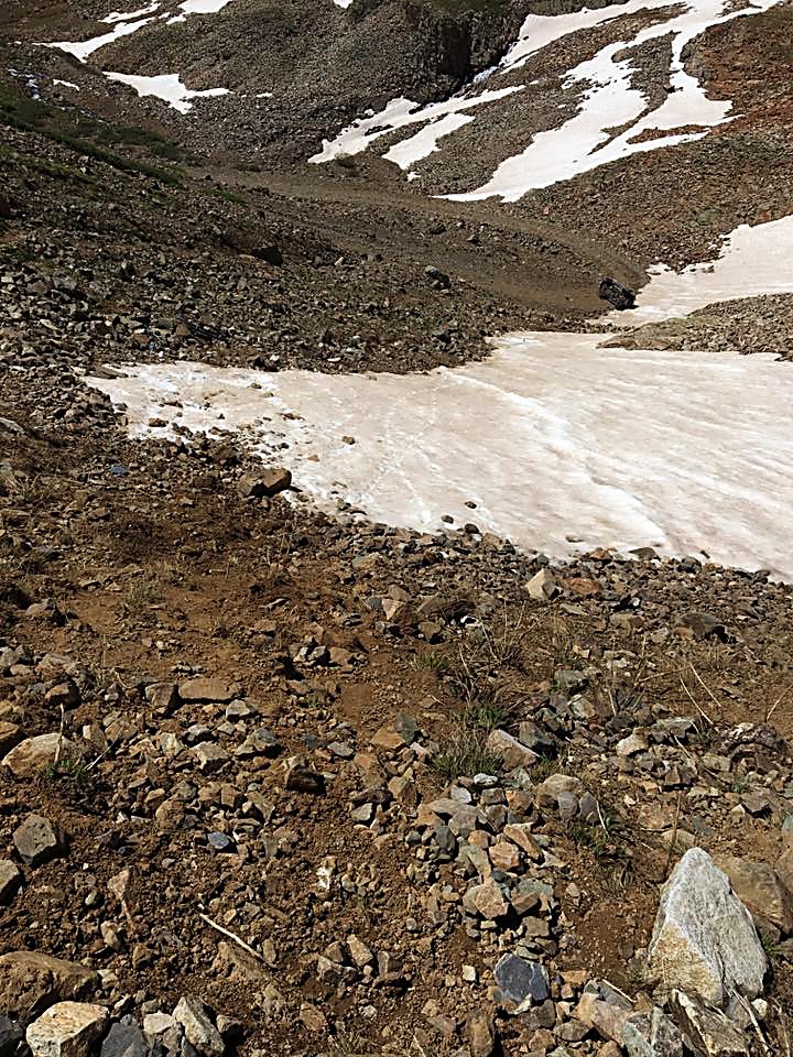 The slope that James Scully tumbled down in his Toyota FJ Cruiser on Saturday. The truck can be seen toward the top right side of the photograph near the edge of the switchback in the road, next to the snow.