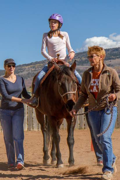 Gwen Carew was diagnosed with a form of autism and uses the therapy sessions at WindWalkers for socializing with people and animals, as well as a form of therapy to help calm her mind.