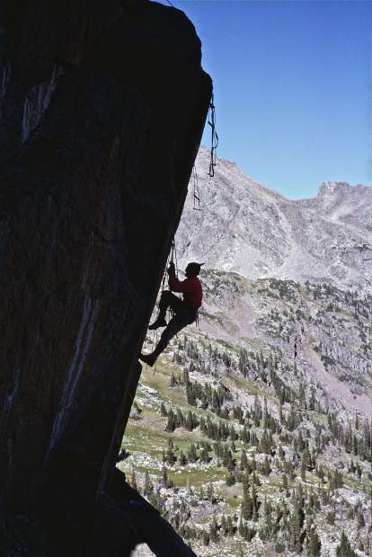 Dick Pownall in his natural habitat, climbing. This is a Gore Range spire.