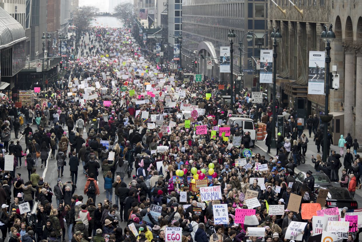 Demonstrators march across 42nd Street during a women's march, Saturday, Jan. 21, 2017, in New York. 
