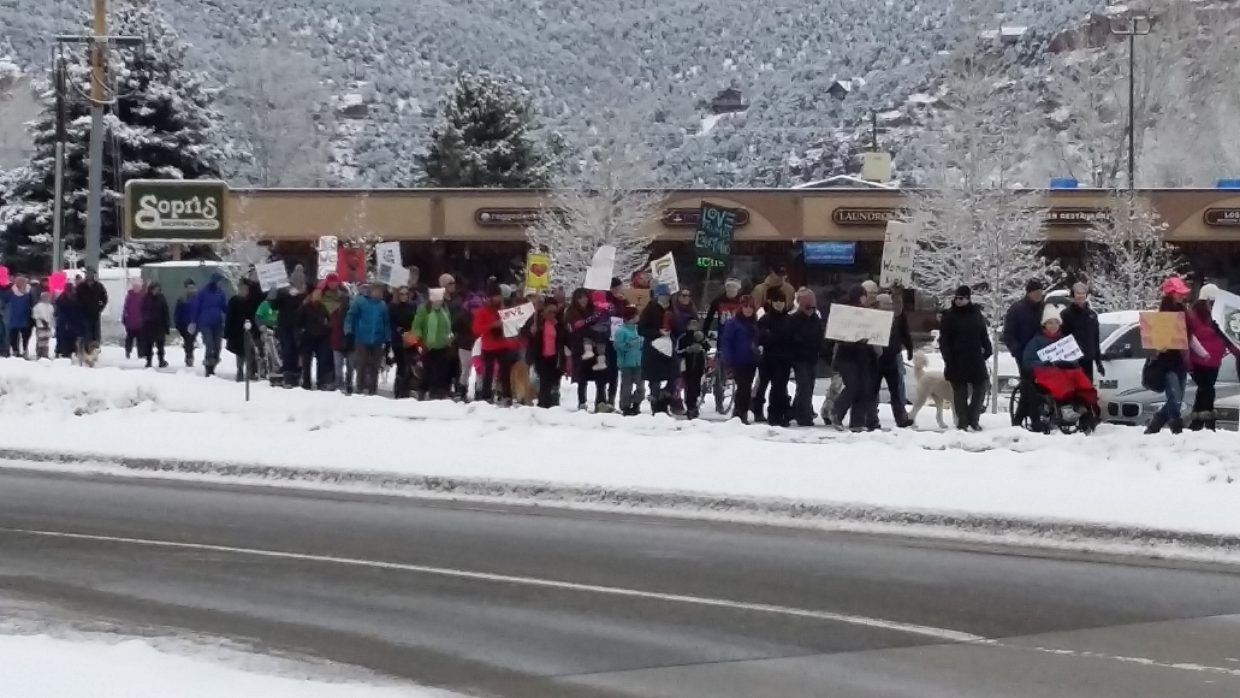 Carbondale marchers Saturday stream along Colorado 133. 