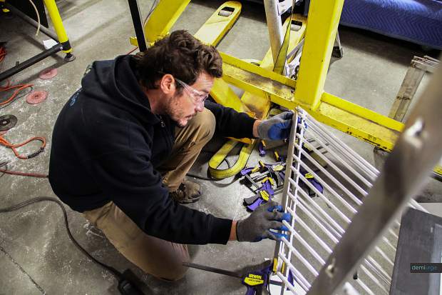 Artist Wynn Earl Buzzell Jr. works on Motio in Demiurge's Denver studio. Demiurge is a sculptural and architectural fabrication company.