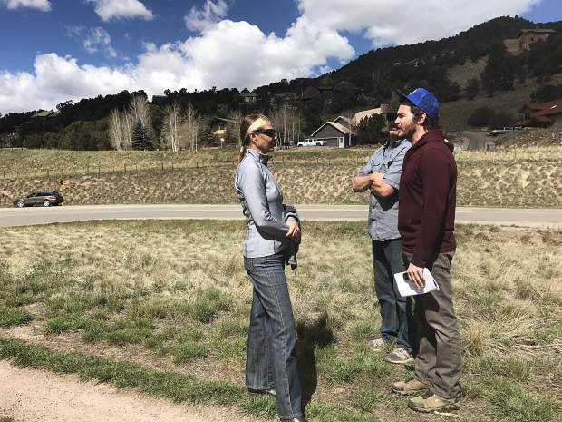 Basalt Public Arts Commission's Nancy Lovendahl and Glenn Smith speak to artist Wynn Earl Buzzell Jr. during a Wednesday site visit in Basalt. A group toured propsed sites for Buzzell's sculpture, which will be installed in June.