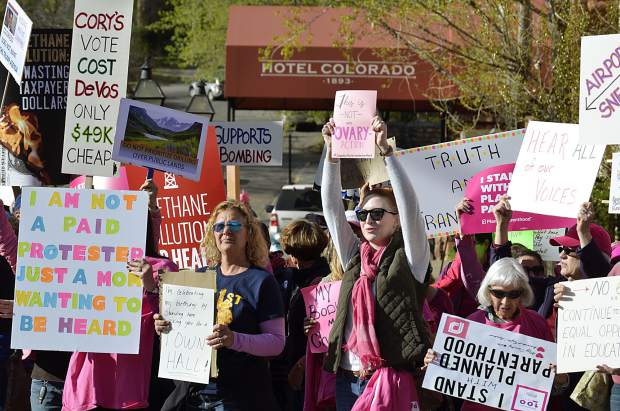 Probably more than 100 people rallied outside the Hotel Colorado Friday evening as Sen. Cory Gardner held a closed-door fundraising dinner. Protesters repeatedly chanted 