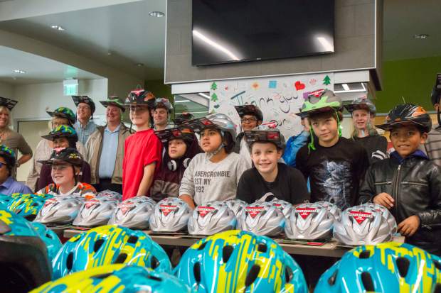 Glenwood Springs Middle School students pose with the brand new bike helmets that were provided by Alpine Bank.