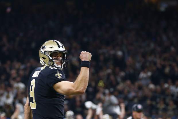 New Orleans Saints quarterback Drew Brees (9) reacts after a touchdown carry by running back Alvin Kamara, not pictured, in the first half of an NFL football game against the Pittsburgh Steelers in New Orleans, Sunday, Dec. 23, 2018. (AP Photo/Butch Dill)