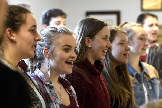 Members of the Glenwood Springs High School are all smiles as they sing for visiting musician Leon WIlliams Tuesday.