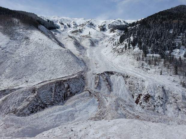 An avalanche dumped tons of snow and debris in the Conundrum Creek Valley floor beneath the area known as Five Fingers. The massive avalanche started at Highlands Ridge at the top.
