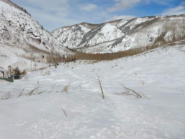 Thsi view to the north shows the approximate area where the Conundrum Creek trailhead was located. Once thick with trees, it is now barren and buried under several feet of snow.