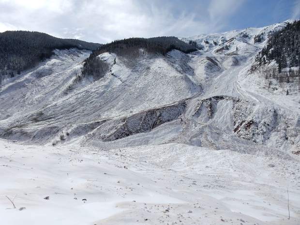 The avalanche scoured the snow to the ground in K Chutes, left, and Five Fingers. Hundreds if not thousands of mature trees were uprooted.