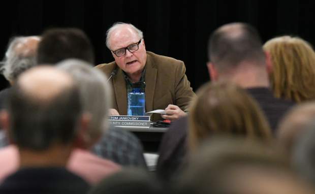 Garfield County Commissioner Tom Jankovsky raises questions during a presentation by representatives of  Rocky Mountain Resources at a public meeting held at Glenwood Springs Middle School on Monday evening.