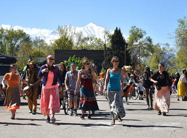 Ngoma Drum and Dance lead the parade of species to celebrate Dandelion Day in Carbondale.