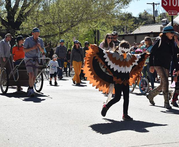 Hundreds participated in Carbondale's parade of species, dressed up as real or imaginary animals, to celebrate Dandelion Day.