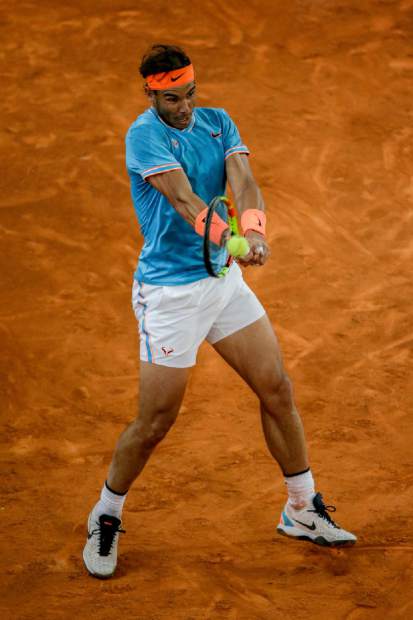 Rafael Nadal of Spain returns the ball to Stefanos Tsitsipas of Greece during the Madrid Open tennis men's semi-final match in Madrid, Spain, Saturday, May 11, 2019. (AP Photo/Bernat Armangue)