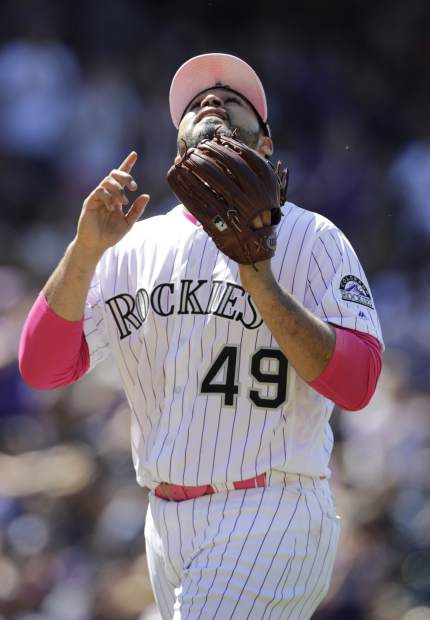Colorado Rockies starting pitcher Antonio Senzatela points skyward as he leaves a baseball game in the seventh inning against the San Diego Padres in Denver, Sunday, May 12, 2019. (AP Photo/Joe Mahoney)
