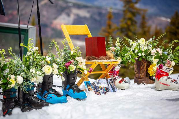 Ski boots filled with flowers and pictures of Sam Coffey pay homage to the loss of a beloved local.