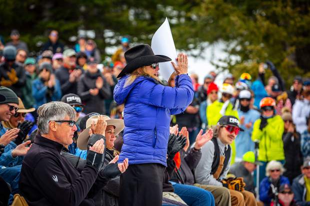 Sam Coffey's mother, Cathy, cheers as Mark Engel concludes a song dedicated to Coffey at a memorial service Monday.
