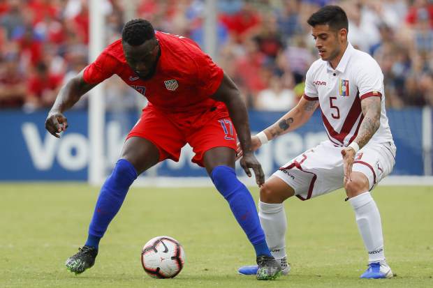 United States forward Jozy Altidore (17) and Venezuela midfielder Junior Moreno (5) vie for the ball during the second half of an international friendly soccer match, Sunday, June 9, 2019, in Cincinnati. (AP Photo/John Minchillo)