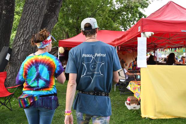 Michael Gorman walks with other volunteers at the 48th annual Carbondale Mountain Fair on Friday evening.