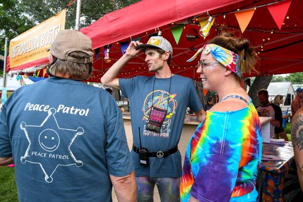 Michael Gorman walks with other volunteers at the 48th annual Carbondale Mountain Fair on Friday evening.