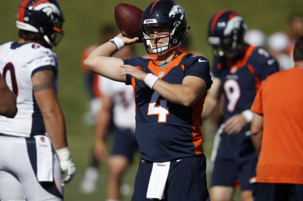 Denver Broncos quarterback Brett Rypien looks to pass the ball during drills at the team's NFL football training camp Friday, July 19, 2019, in Englewood, Colo. (AP Photo/David Zalubowski)