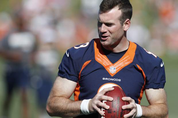 Denver Broncos quarterback Kevin Hogan looks to pass the ball during drills at the team's NFL football training camp Friday, July 19, 2019, in Englewood, Colo. (AP Photo/David Zalubowski)