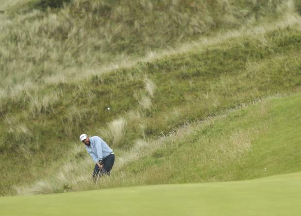 J.B. Holmes of the United States plays out of the rough on 17th hole during the final round of the British Open Golf Championships at Royal Portrush in Northern Ireland, Sunday, July 21, 2019.(AP Photo/Jon Super)