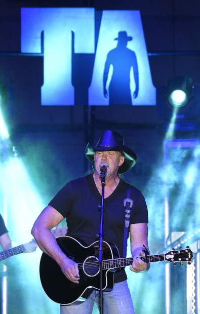 Country music star Trace Adkins sings a ballad to warm up the crowd Friday night in the Outdoor arena at the Garfield County Fair.