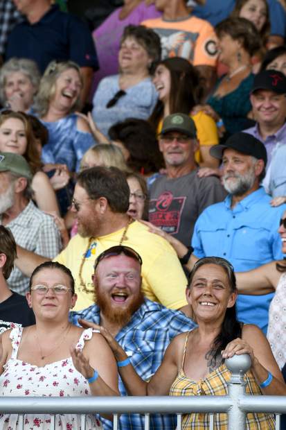 The crowd in the grandstand gets into the mood of the music as Joe Nichols urges concert goers to get to know their neihbor a little better.