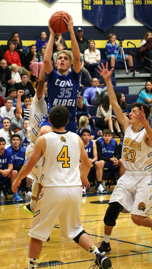 Coal Ridge junior Hank DiMarco goes up for the shot Tuesday night in the Titan's 52-25 win over the Rifle Bears.