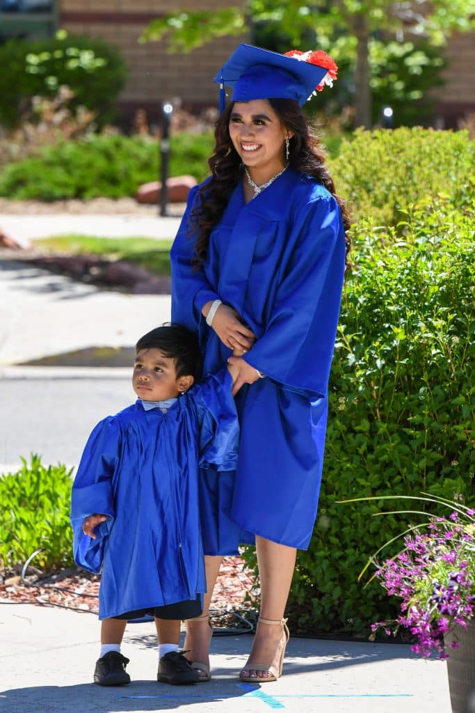A Yampah Mountain High School graduate listens in as her advisor says a few words about her at the drive-in graduation ceremony on Friday morning.