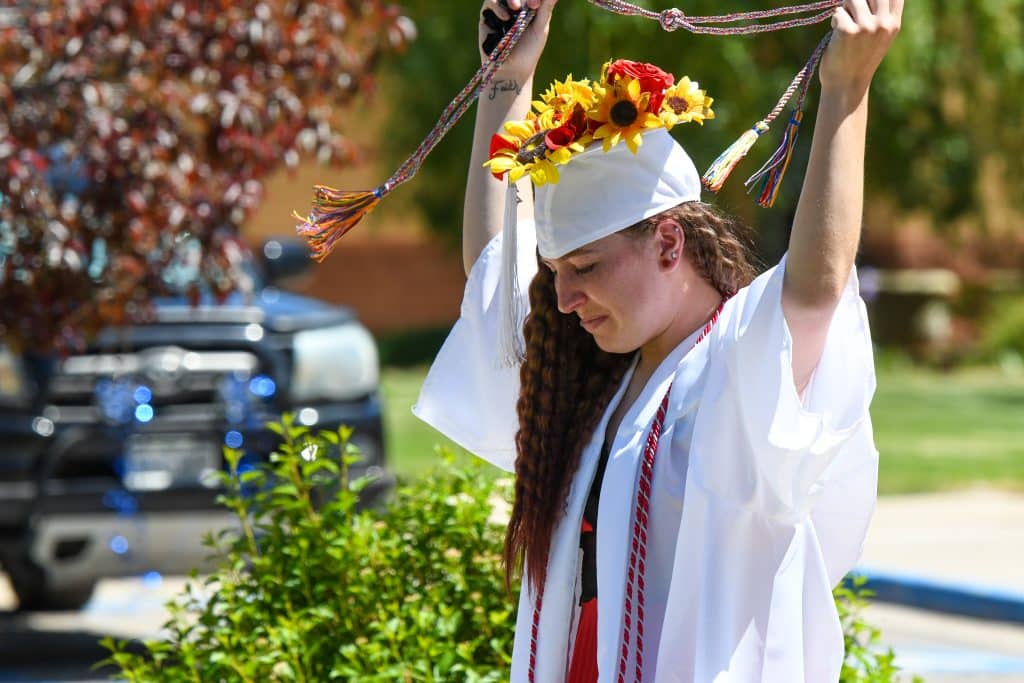 A Yampah Mountain High School graduate recieves a special graduation cord at the drive-in ceremony on Friday morning.
