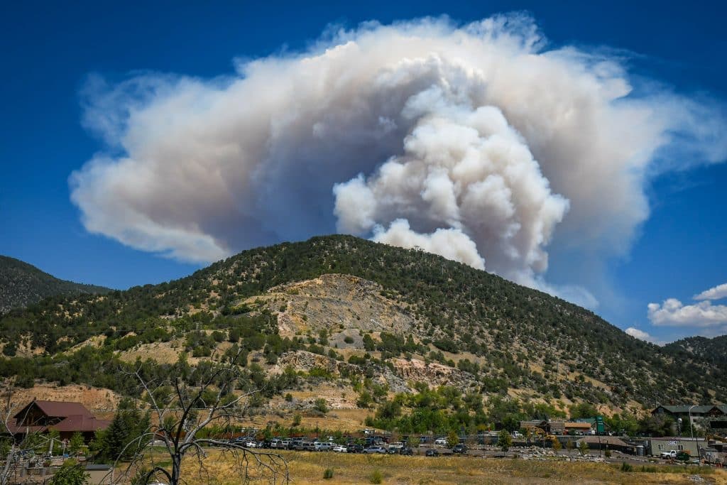 Smoke from the Grizzly Creek Fire in Glenwood Canyon billows over the Glenwood Springs Adventure Park on Monday afternoon.
