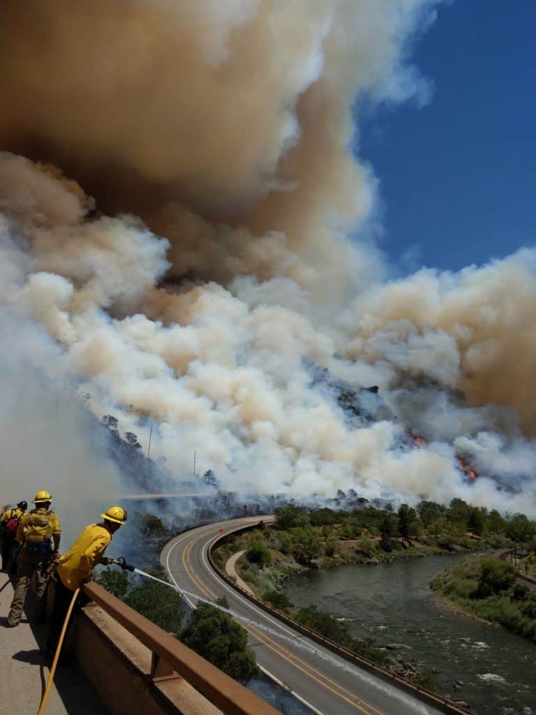 The Grizzly Creek wildfire in Glenwood Canyon east of Glenwood Springs blows up fast Monday afternoon, Aug. 10, as firefighters observe from the upper (westbound) deck of Interstate 70.