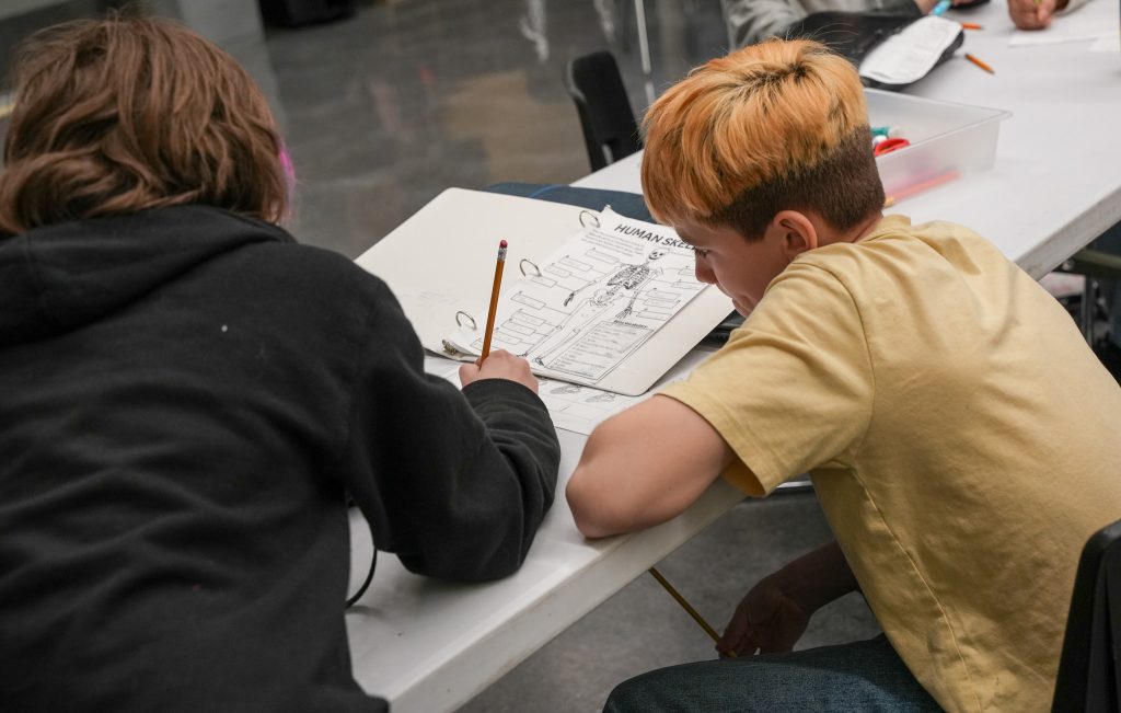 Musicians Reach for Magnifying Glasses at Rifle Middle School
