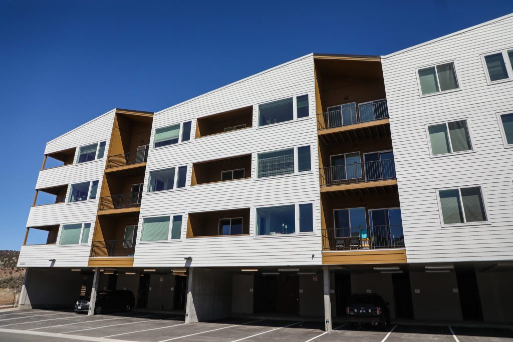 Colorado governor signs bill giving zoning exemptions to nonprofits, schools that want to build housing 