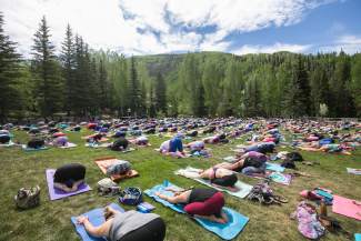 Hundreds of Mountain Game atendees enjoy The Yoga Girl Experience held in the Betty Ford Gardens Saturday.  The specific session was deemed, The Art of Letting Go.