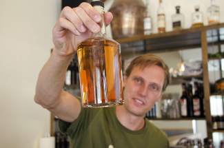 Max Vogelman shows off his Colorado rum.