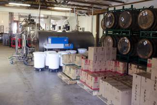 The tasting room and main production facility share a building.