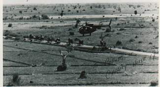 Carl Gray is at the controls of this OH-6, a reconnaissance helicopter he flew through two tours of duty in Vietnam. Gray started flying in 1967, and retired this week from HAATS.