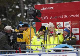 The American podium celebrates in Canada. Julia Mancoso, Lindsey Vonn and Stacey Cook, from left.
