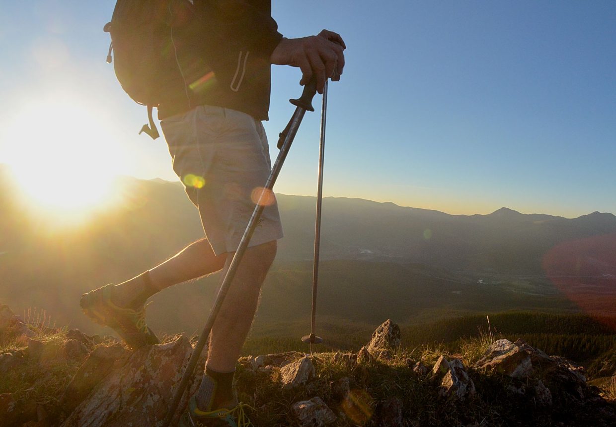A hiker moves along the ridgeline just below the summit of Peak One (12,805 feet) at sunrise. Peak One is the first major climb of the Tenmile Traverse, a 14.5-mile trek on high-alpine terrain between Frisco and Breckenridge.